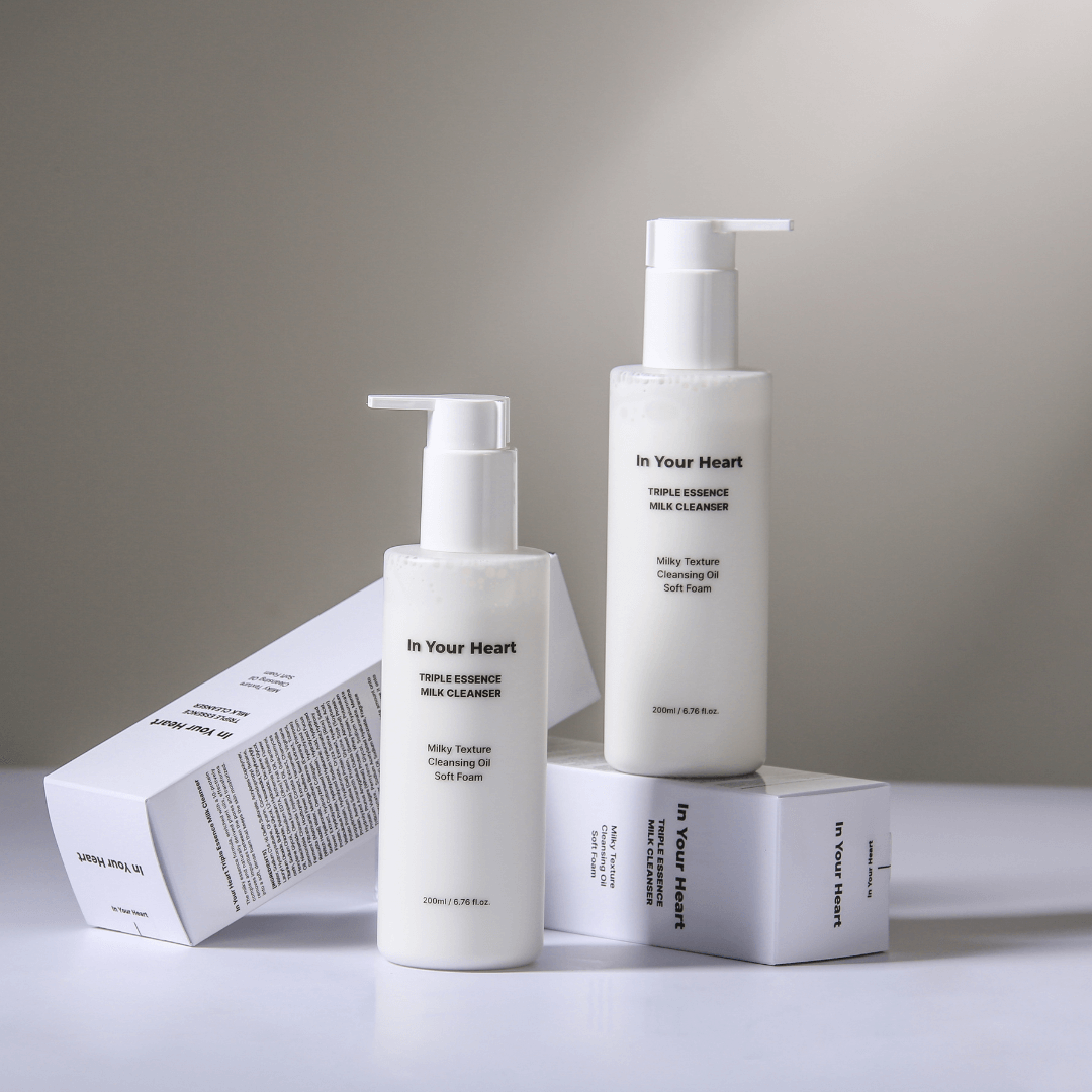 IN YOUR HEART Triple Essence Milk Cleanser bottles on display with packaging, highlighting a multi-texture skincare routine.