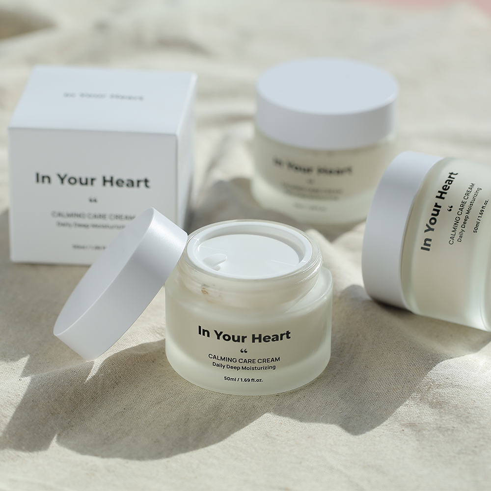 In Your Heart Calming Care Cream jar and box on a soft surface, perfect for sensitive skin care.