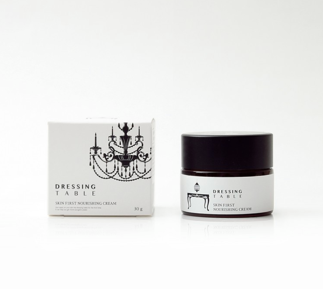 DRESSINGTABLE Skin First Nourishing Cream jar and box packaging, promoting intensive hydration and skin repair.