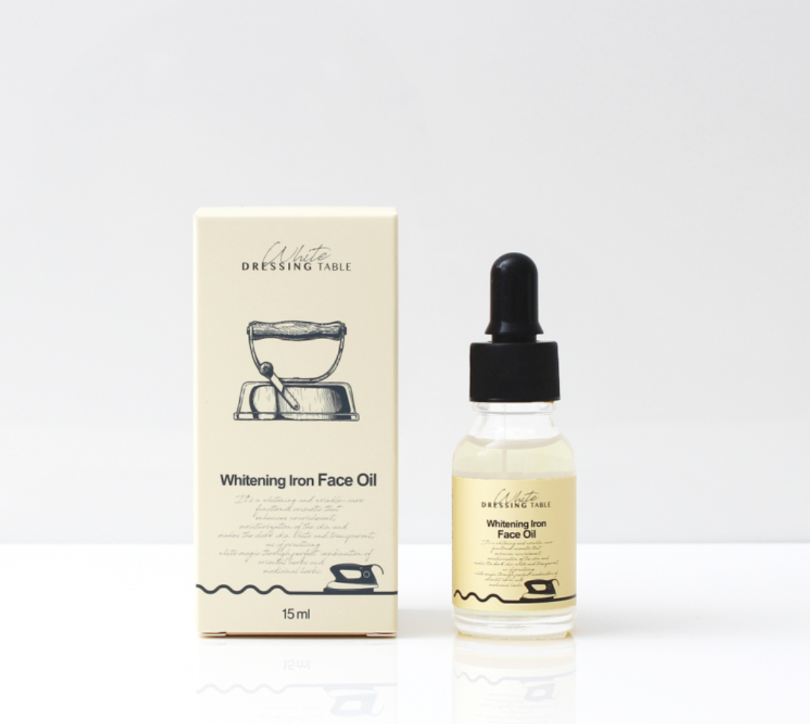 DRESSINGTABLE Brightening Iron Face Oil bottle with box, ideal for deep hydration and a radiant glow.