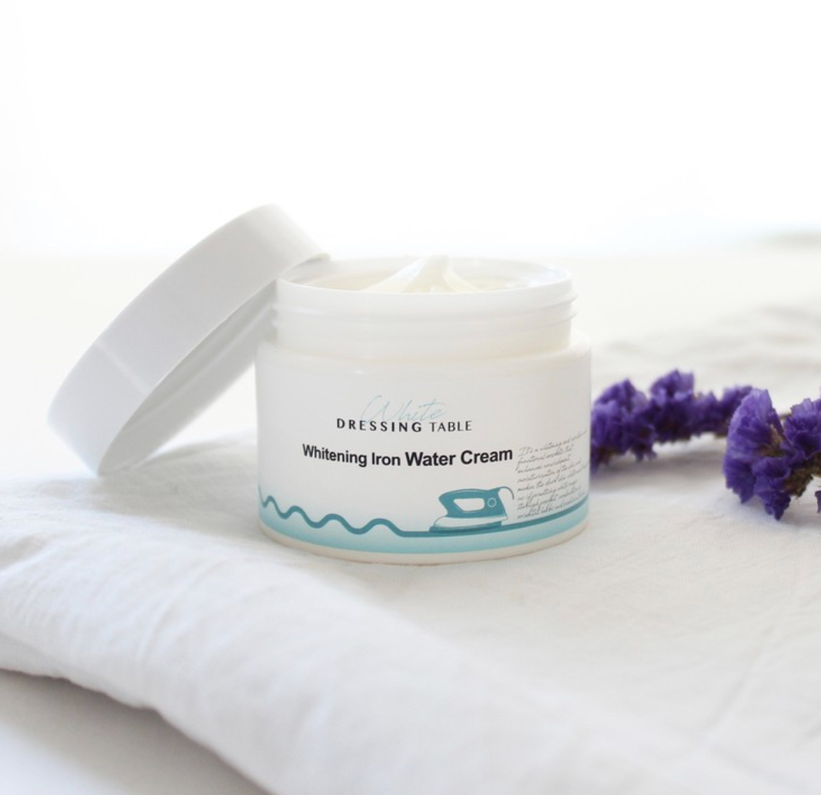 DRESSINGTABLE Brightening Iron Water Cream in a jar with natural ingredients and a soothing design.