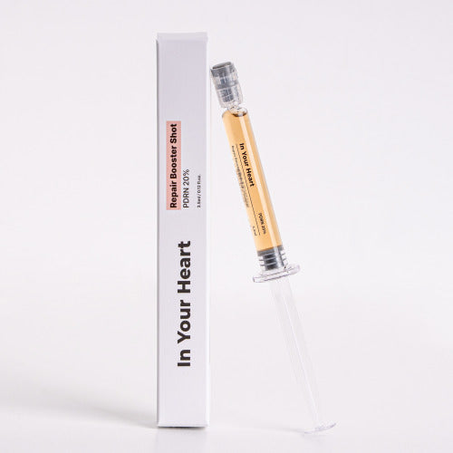 IN YOUR HEART Repair Booster Shot in a syringe with packaging, designed for skin rejuvenation and repair.