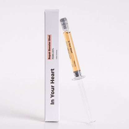 IN YOUR HEART Repair Booster Shot in a syringe with packaging, designed for skin rejuvenation and repair.