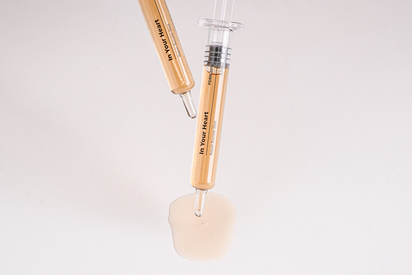 IN YOUR HEART Repair Booster Shot ampoules with rejuvenating serum for skin repair and elasticity.