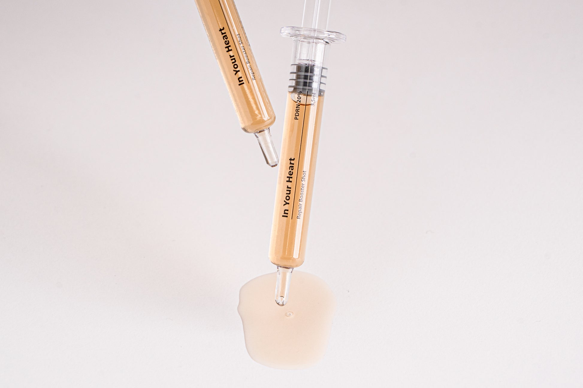 IN YOUR HEART Repair Booster Shot ampoules with rejuvenating serum for skin repair and elasticity.