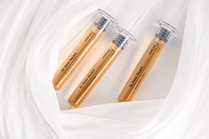 IN YOUR HEART Repair Booster Shot ampoules arranged on soft fabric background