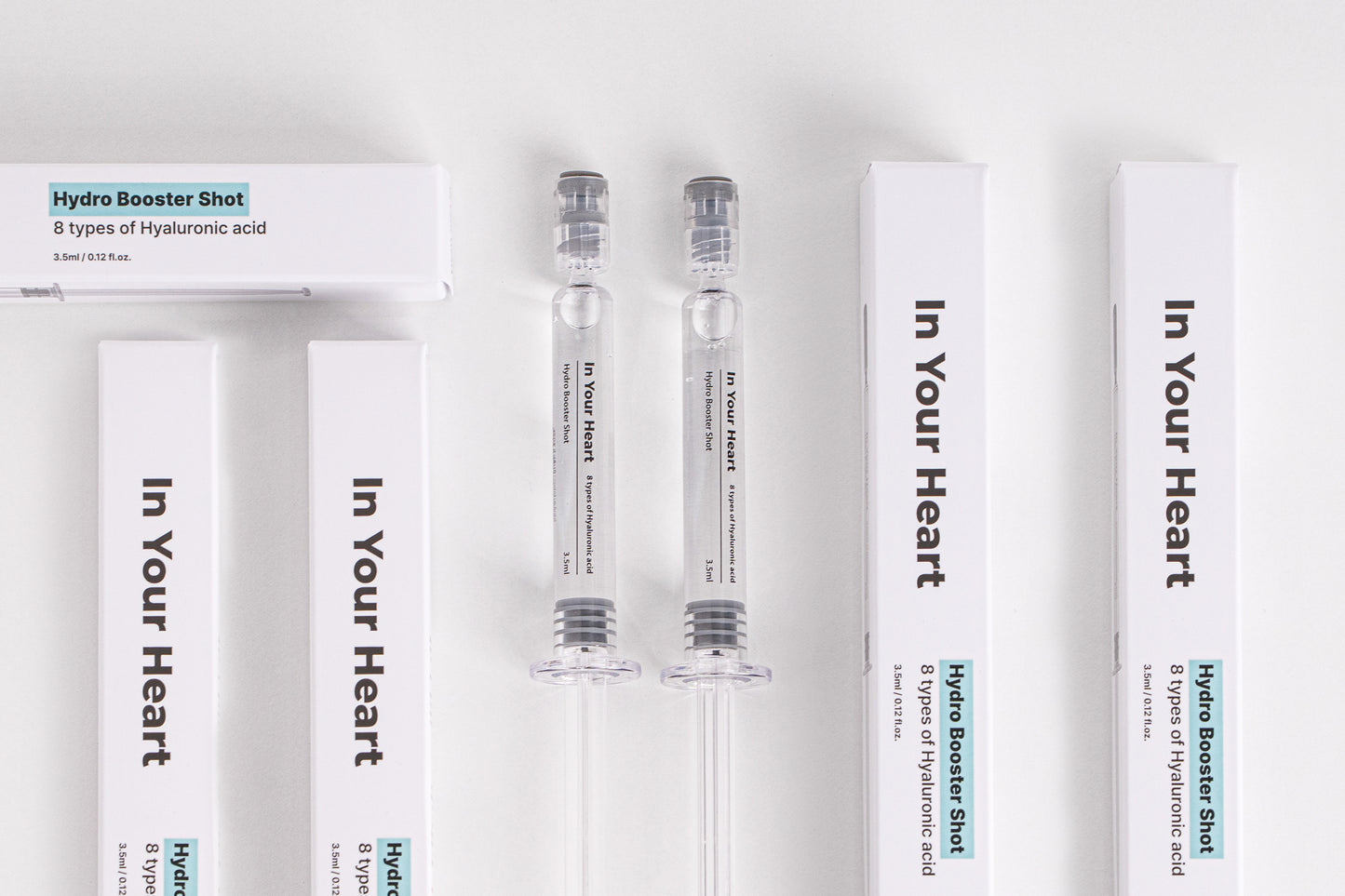 IN YOUR HEART Hydro Booster Shot packaging and ampoules on a clean white background.