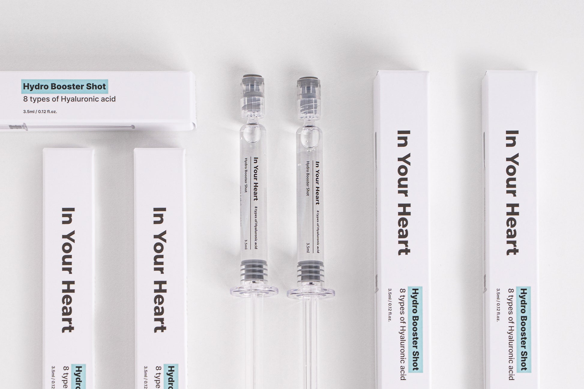 IN YOUR HEART Hydro Booster Shot packaging and ampoules on a clean white background.
