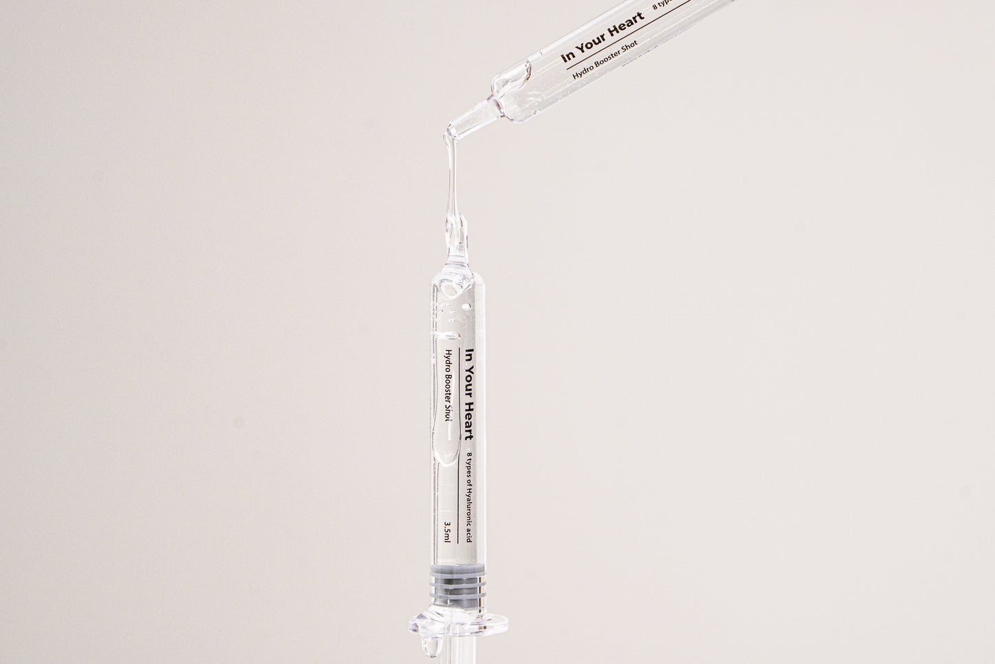 IN YOUR HEART Hydro Booster Shot in a dropper ready to deliver instant hydration and moisture.