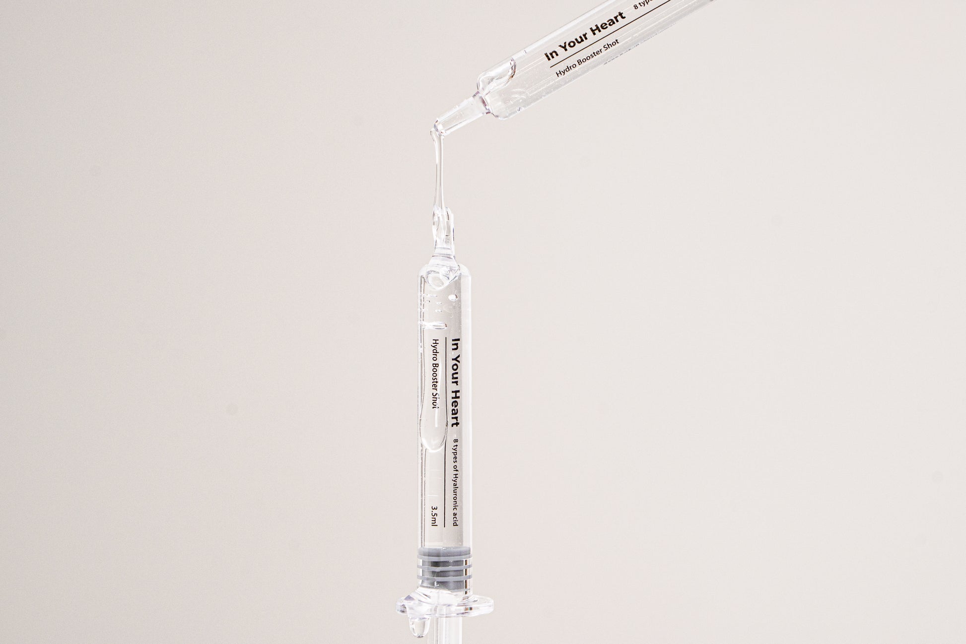 IN YOUR HEART Hydro Booster Shot in a dropper ready to deliver instant hydration and moisture.