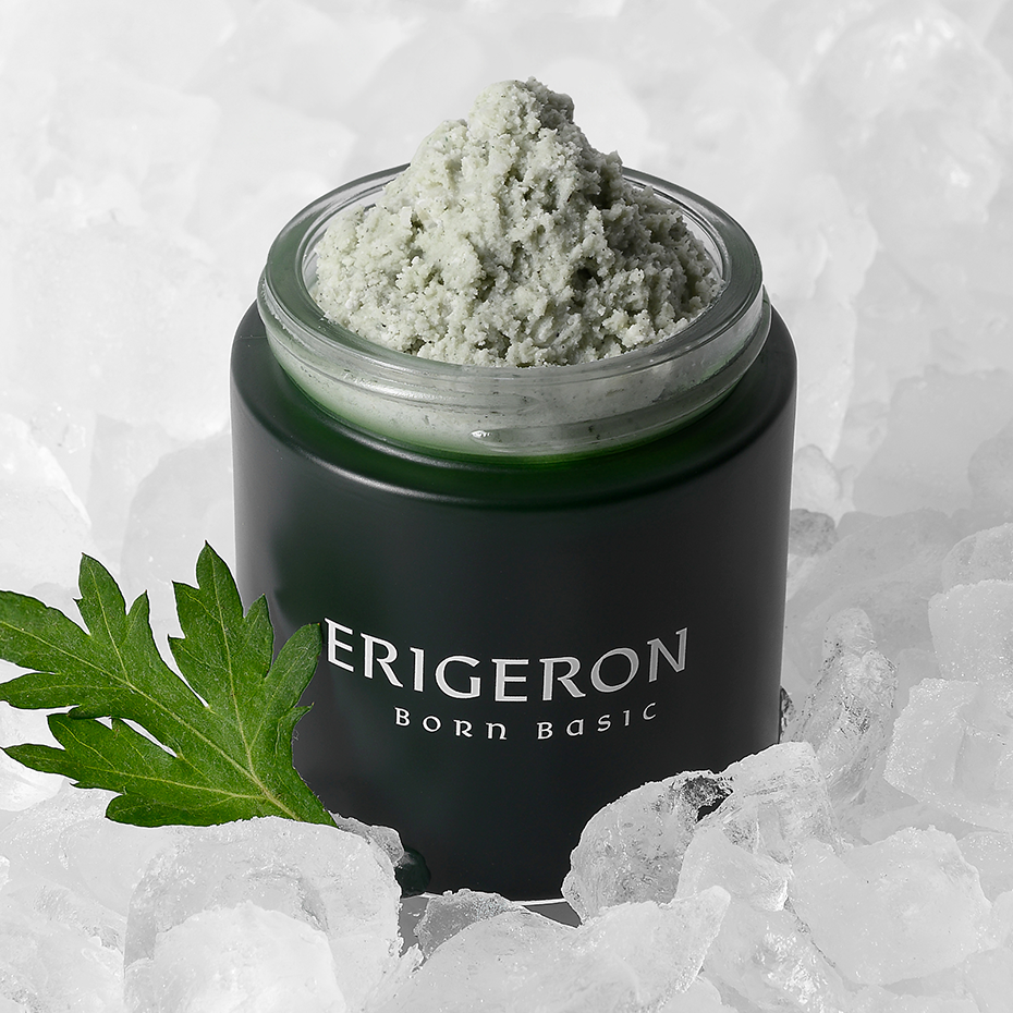 A jar of Erigeron Houttuynia Cordata Green Pack Cleanser surrounded by ice, showcasing its fresh and soothing formula.