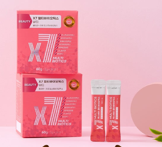 Two boxes of pink X7 Multi Biotics Beauty stacked on a pink background with two individual stick packs placed beside them.