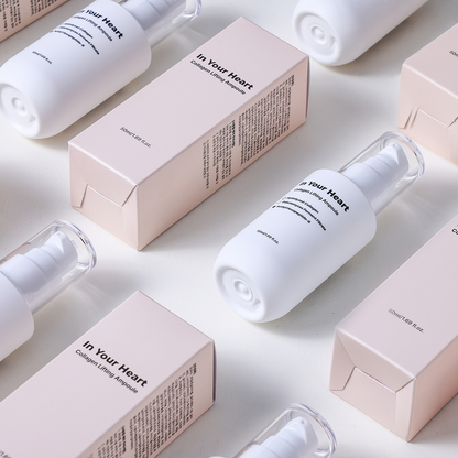 Multiple bottles and boxes of In Your Heart Collagen Lifting Ampoule arranged in a neat grid.