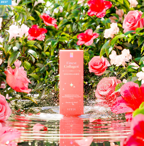 A box of VITIV Finest Collagen placed in a lush garden setting with pink and white flowers reflected in water below.