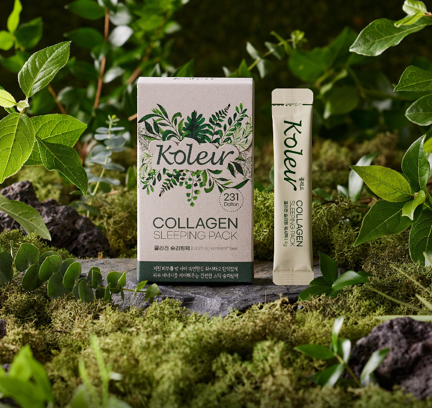 Koleur Collagen Sleeping Pack box and one stick sachet displayed in a lush, green forest setting with moss and leaves, showcasing its natural-inspired theme.