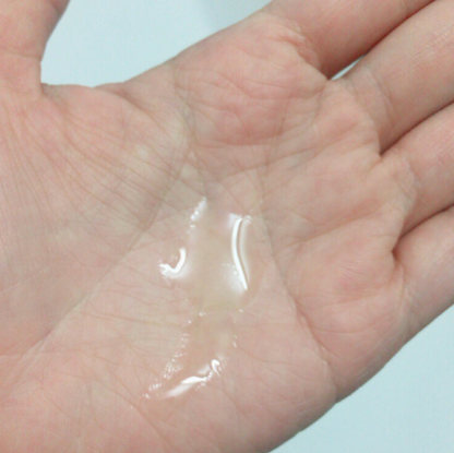 hand with clear liquid in hand