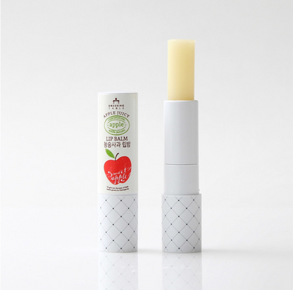 Apple Lip Balm with its cap removed, showcasing the pale yellow balm. The tube features a minimal design with a red apple graphic and "Sweet Apple" text, displayed on a clean white background.