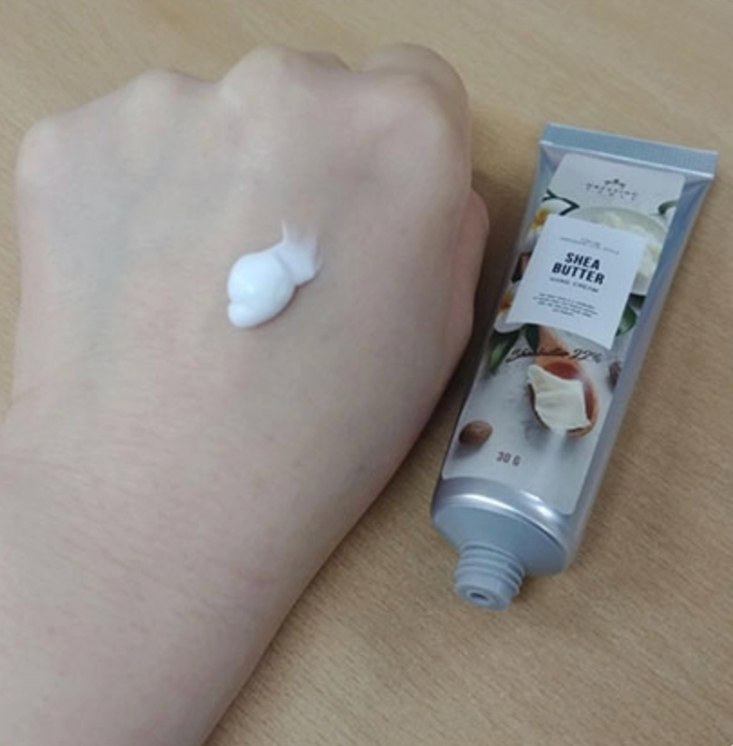 tube of hand cream and hand cream swatch on hand